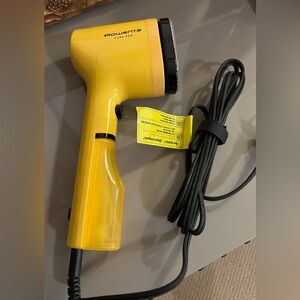 Bright Yellow Handheld Rowenta steamer, used a few times . Works great ! 😊